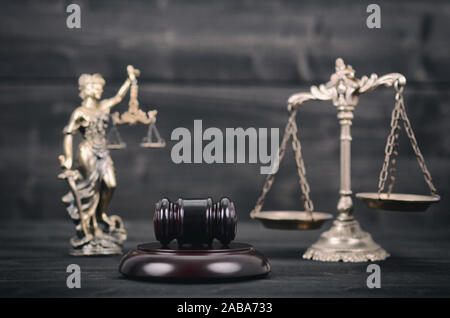 Law and Justice, Legality concept, Lady Justice, Scales of Justice and Judge Gavel on a black wooden background. Stock Photo