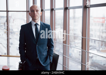 Portrait of smiling young businessman in office Stock Photo