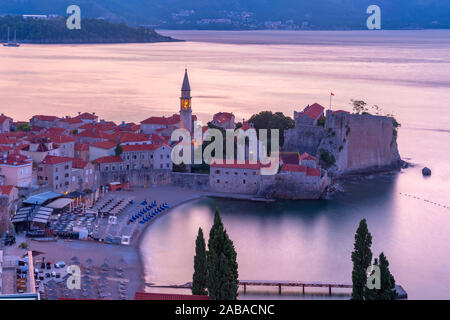 Aerial view over Old Town of Montenegrin town Budva on the Adriatic Sea at pink sunrise, Montenegro Stock Photo