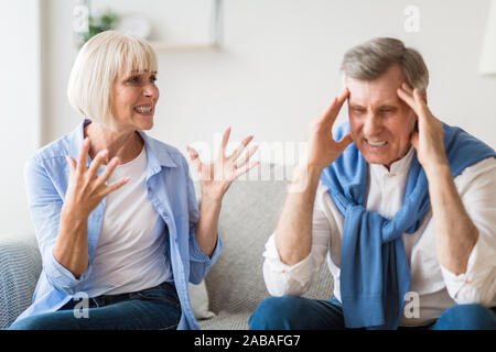 Divorce concept. Senior couple having disagreement at home Stock Photo