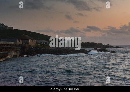 St Mary's quay, Rat Island and The Garrison, Isles of Scilly at dusk Stock Photo