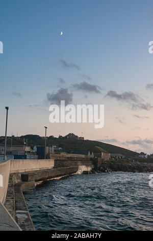 St Mary's quay, Rat Island and The Garrison, Isles of Scilly at dusk Stock Photo