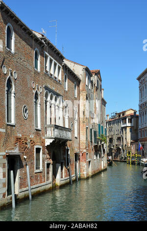 Venetian canal in the disdrict San Polo of Venice with ancient buildings - Italy. Stock Photo