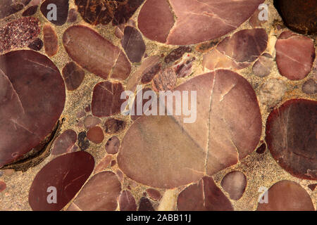 Pink granite Colorful texture with bubbles, Polished Stone Background, abstract stone surface with bubbles. Stock Photo