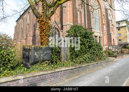 Old mine car, coal wagon of the former Osterfeld colliery in Oberhausen, in front of the St. Pankratius church on  Bottroper Street, Stock Photo