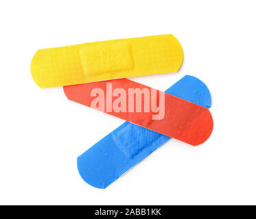 Top view of colorful adhesive bandage patches isolated on white Stock Photo