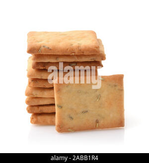 Stack of garlic, rosemary and sea salt crackers isolated on white Stock Photo