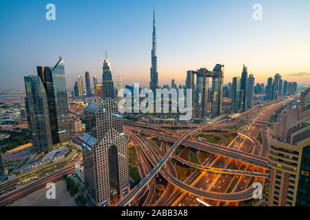 Skyline of Dubai, Sheikh Zayed Road and Burj Khalifa skyscraper at dusk in Dubai, United Arab Emirates