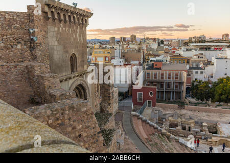 Aerial panoramic view of port city Cartagena in Spain with famous roman amphitheater. Beautiful sunset over the mountains. Wide angle lens panorama. Stock Photo