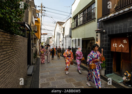 Kyoto, Japan - 10/30/19 - Women walking in the street with traditional kimonos