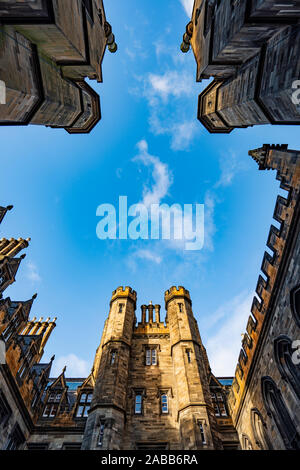Looking up from the courtyard of New College at the University of Edinburgh, the Faculty of Divinity, on The Mound in Edinburgh Old Town, Scotland, UK Stock Photo