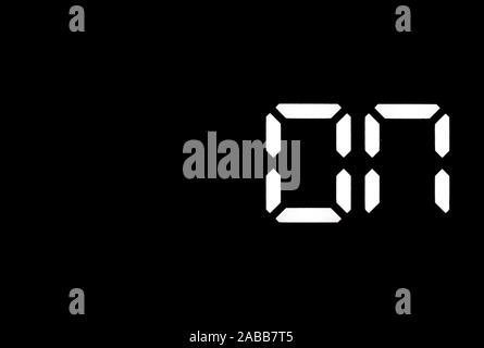 Real white led digital clock on a black background showing on Stock Photo