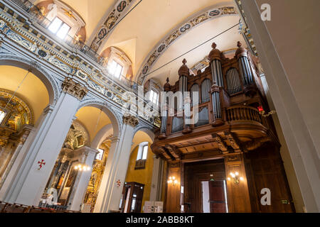 The large wooden pipe organ in the Cathedral Sainte Reparate in the Old Town section of Nice, France, on the French Riviera. Stock Photo