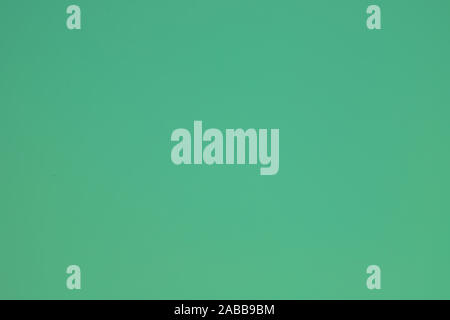Simple smooth clean light green background.Perfect image of empty green surface, verdant. Abstract beautiful lime background with copy space for text. Stock Photo