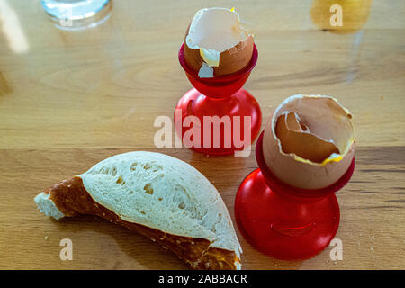 Empty egg shell in egg cup red Stock Photo