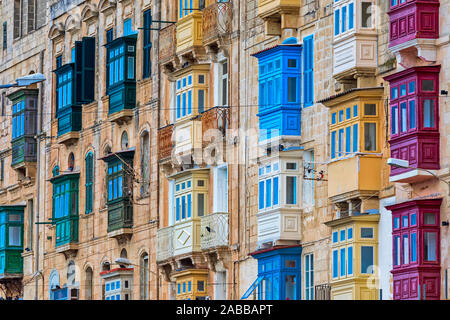 Residential building with traditional colorful wooden balconies in Valletta, Malta. Stock Photo