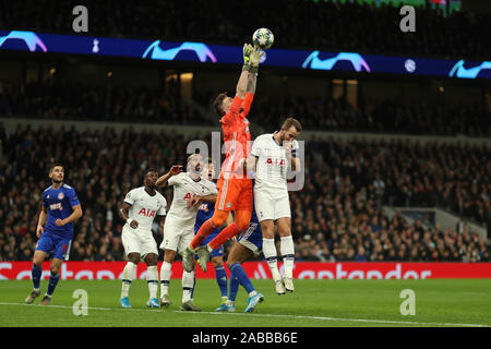 London, UK. 26th Nov 2019. UEFA Champions League Football, Tottenham Hotspur versus Olympiacos; Jose Sa of Olympiakos collects the ball over Harry Kane of Tottenham Hotspur - Editorial Use Credit: Action Plus Sports Images/Alamy Live News Stock Photo