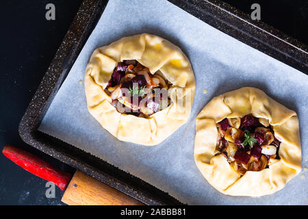 Healthy food concept preparation for Homemade rustic organic roasted beets and caramel galette pie with copy space Stock Photo