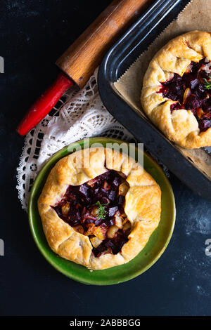 Healthy food concept Homemade rustic organic roasted beets and caramel galette pie with copy space Stock Photo