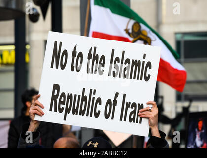 Torontonians gather at Mel Lastman Square to show support for the protesters in Iran while condemning the regime, while a pre-revolution flag waves. Stock Photo