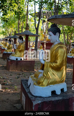 Maha Bodhi Tahtaung, a Buddhist holy site famous for its thousands of statues of the Buddha in reverential postures under bo trees in Monywa, Myanmar Stock Photo