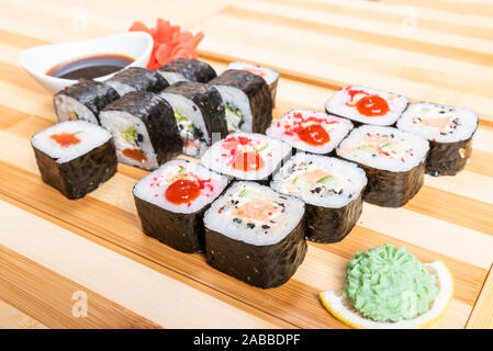 Set of rolls with various fillings, shrimp, salmon and tuna. Close-up. Stock Photo