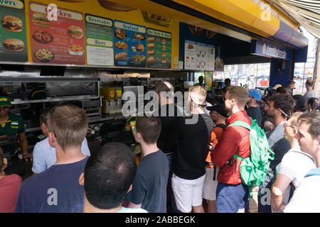 New York, USA - August 20, 2018 Group of people In line at the original Nathan's Hot Dog restaurant at Coney Island, Brooklyn, New York. Stock Photo