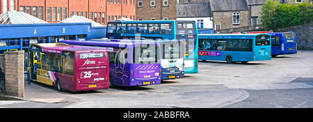Durham City public transport bus station back & side view of single deck & double decker buses loading from covered passenger waiting area England UK
