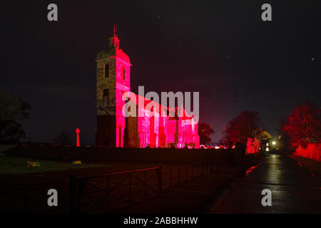 2018 floodlit blood red to commemorate the Centenary of the end of the First World War, Ladykirk church built on the orders of King James IV in 1500 Stock Photo