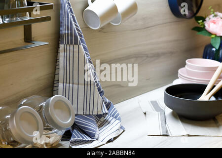 Various kitchen utensils on a modern home kitchen countertop. Selective focus.
