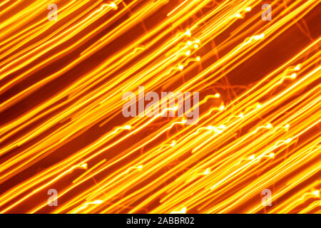 Futuristic blurred lights holiday monochrome background in yellow. Horizontal, soft focus Stock Photo