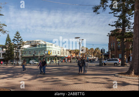 Manly, Australia - June 9th 2015: People strolling along Manly promenade. The town is a desirable suburb of Sydney. Stock Photo