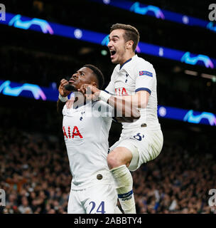London, UK. 26th Nov, 2019. Tottenham Hotspur's Serge Aurier (L) celebrates his goal during the UEFA Champions League Group B match between Tottenham Hotspur and Olympiakos at the Tottenham Hotspur Stadium in London, Britain on Nov. 26, 2019.FOR EDITORIAL USE ONLY. NOT FOR SALE FOR MARKETING OR ADVERTISING CAMPAIGNS. NO USE WITH UNAUTHORIZED AUDIO, VIDEO, DATA, FIXTURE LISTS, CLUB/LEAGUE LOGOS OR 'LIVE' SERVICES. ONLINE IN-MATCH USE LIMITED TO 45 IMAGES, NO VIDEO EMULATION. NO USE IN BETTING, GAMES OR SINGLE CLUB/LEAGUE/PLAYER PUBLICATIONS. Credit: Xinhua/Alamy Live News Stock Photo