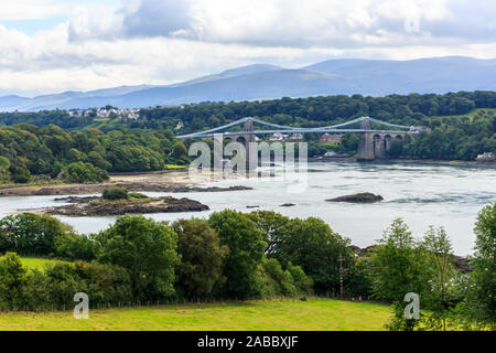 Scenic view of the Menai Straits and the suspension bridge connecting road traffic to the mainland Stock Photo