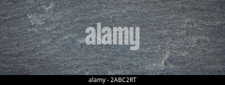 rough texture of blank slate blackboard with white chalk smudges, panoramic banner Stock Photo