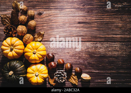 Happy Thanksgiving Day with pumpkin and nut on wooden table Stock Photo