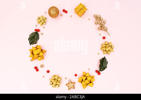 Christmas wreath on pink background. Christmas decoration. Flat lay, top view, copy space Stock Photo