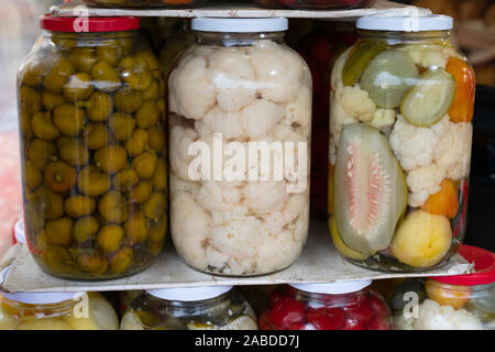 Jars of homemade assortment of vegetables , pickles - romanian cuisine Stock Photo