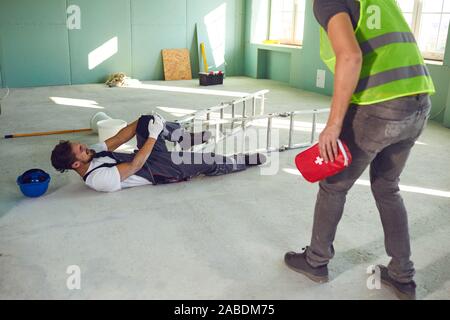 Construction worker accident with a construction worker. Stock Photo
