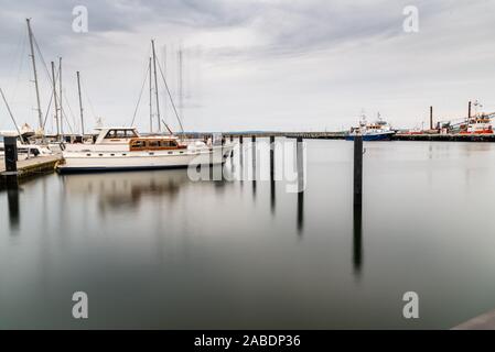 Sassnitz, Germany - August 1, 2019: Scenic long exposure view of sailing boats moored in the harbour. Sassnitz is a small town located in Rugen Island Stock Photo