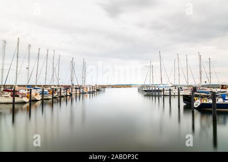 Sassnitz, Germany - August 1, 2019: Scenic long exposure view of sailing boats moored in the harbour. Sassnitz is a small town located in Rugen Island Stock Photo