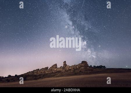 The Milky Way at night over the Teufelsmauer in the Harz Mountains Stock Photo