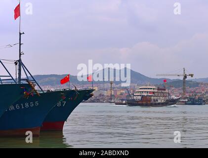 Fishing boats stop at Lanshan fishing port after catching enough ...