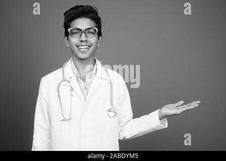 Young Indian boy doctor with eyeglasses in black and white Stock Photo