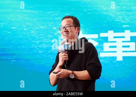 The founder and president of New Oriental Education & Technology Group Inc. Yu Minhong, also known as Michael Yu, delivers a speech at a peer advisory Stock Photo