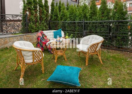 Relaxation with snacks on the table in the garden on a warm clear autumn day - idyllic concept of the weekend break Stock Photo