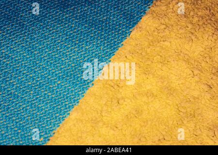 Orange blue color jumper clothing fabric texture sports wear background, close up Stock Photo