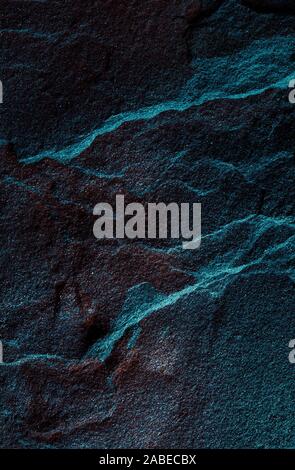 A natural background made of multi-colored wild stone close-up. View from above Stock Photo