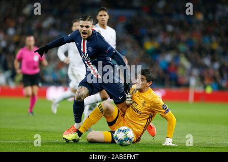 Real Madrid CF's Tibaut Courtois and Mauro Icardi of PSG are seen in action during the UEFA Champions League match, between Real Madrid and Paris Saint Germain at Santiago Bernabeu Stadium in Madrid.(Final score; Real Madrid 2:2 Paris Saint Germain) Stock Photo