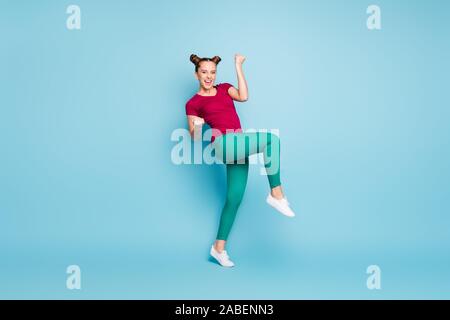 Full length body size photo of cheerful rejoicing white girlfriend wearing green trousers pants footwear expressing positive emotions isolated over Stock Photo